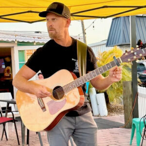 Phil Miguel playing guitar